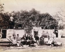 An affluent family forced to leave their home due to plague in their neighbourhood sitting...1896/7. Creator: Unknown