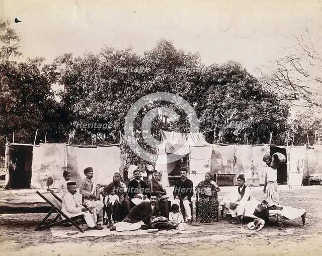 An affluent family forced to leave their home due to plague in their neighbourhood sitting...1896/7. Creator: Unknown.