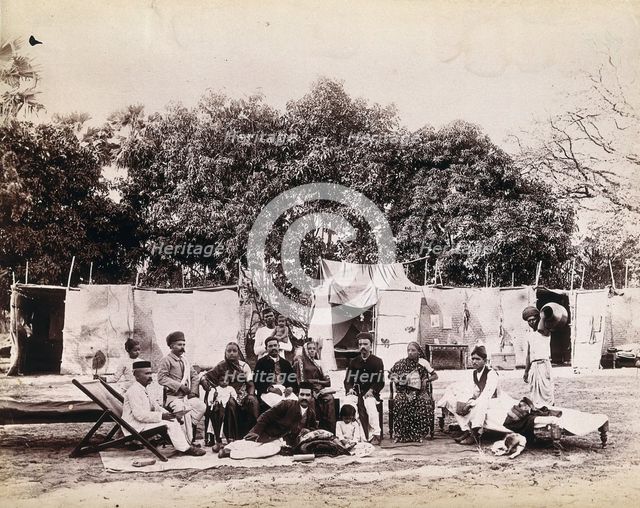 An affluent family forced to leave their home due to plague in their neighbourhood sitting...1896/7. Creator: Unknown.