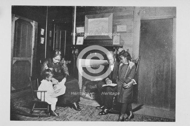 An African American family; Reading books, 1922. Creator: Unknown.
