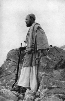 An Afridi lookout, Khyber and Kohat Pass, Pakistan and Afghanistan, 1922.Artist: Holmes & Co