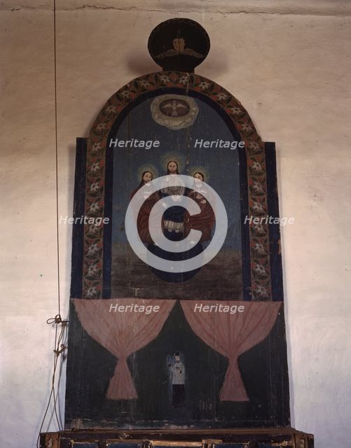 An altar in the church dedicated to the Trinity, Trampas, N.M., 1943. Creator: John Collier.
