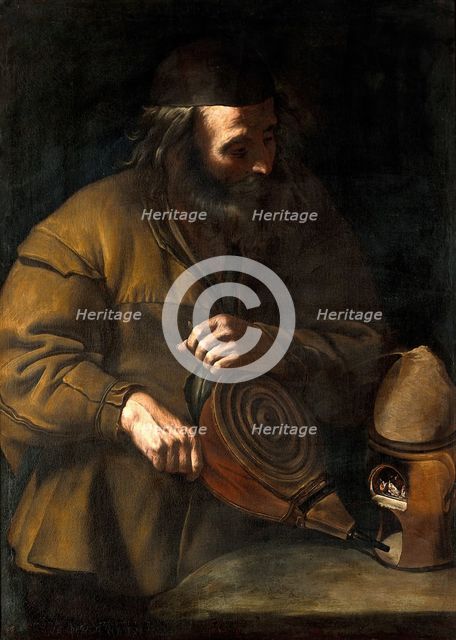 An alchemist applying bellows to a fire beneath a retort, 18th (?) century. Creator: Unknown.