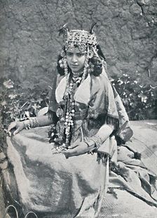 An Algerian woman in gala costume, 1912. Artist: Neurdein freres