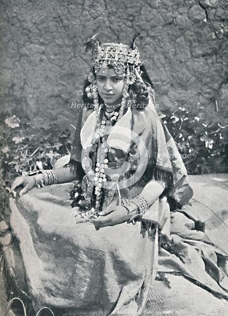 An Algerian woman in gala costume, 1912. Artist: Neurdein freres.