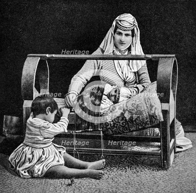 An Armenian mother and her children, 1922.Artist: W Llewellyn Williams