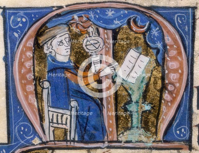 An astrologer at work with his book and an armillary, early 14th century. Creator: Unknown.