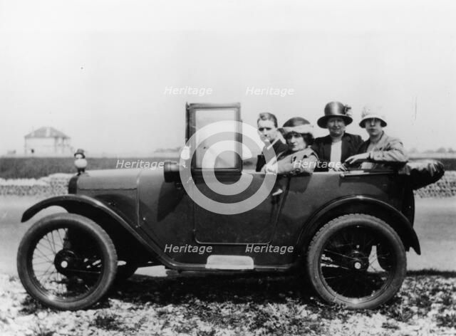 An Austin Seven Chummy with passengers, 1925. Artist: Unknown