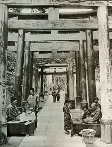 An Avenue of Torii at Inari 1910. Creator: Herbert Ponting