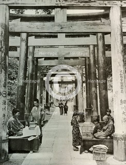'An Avenue of Torii at Inari', 1910. Creator: Herbert Ponting.