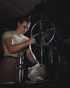 An employee in the drill-press section of North American's huge machine..., Inglewood, Calif. , 1942 Creator: Alfred T Palmer