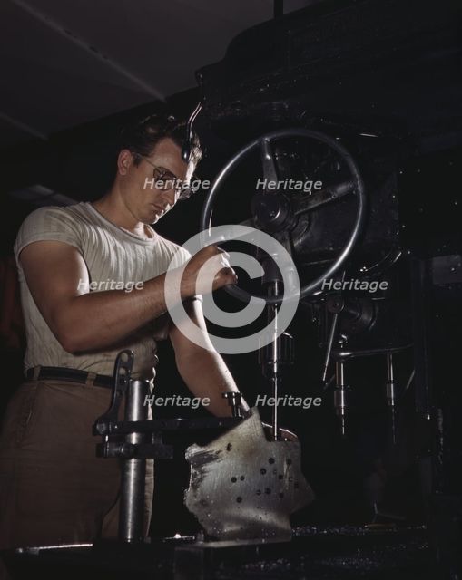 An employee in the drill-press section of North American's huge machine..., Inglewood, Calif. , 1942 Creator: Alfred T Palmer.
