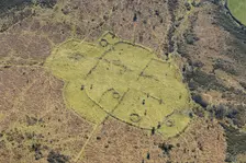 An enclosed stone hut circle settlement on Buckland Common, Dartmoor, Devon, 2025. Creator: Damian Grady