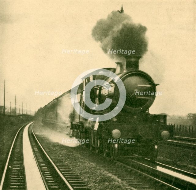 'An Engine of the Star Class Picking Up Water at Speed, Goring, Great Western Railway', 1930. Creator: Unknown.