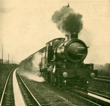 An Engine of the Star Class Picking Up Water at Speed, Goring, Great Western Railway 1930. Creator: Unknown