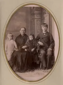 An elderly woman, a young man in a civilian suit and two.,, late 19th cent - early 20th cent. Creator: PA Milevskii