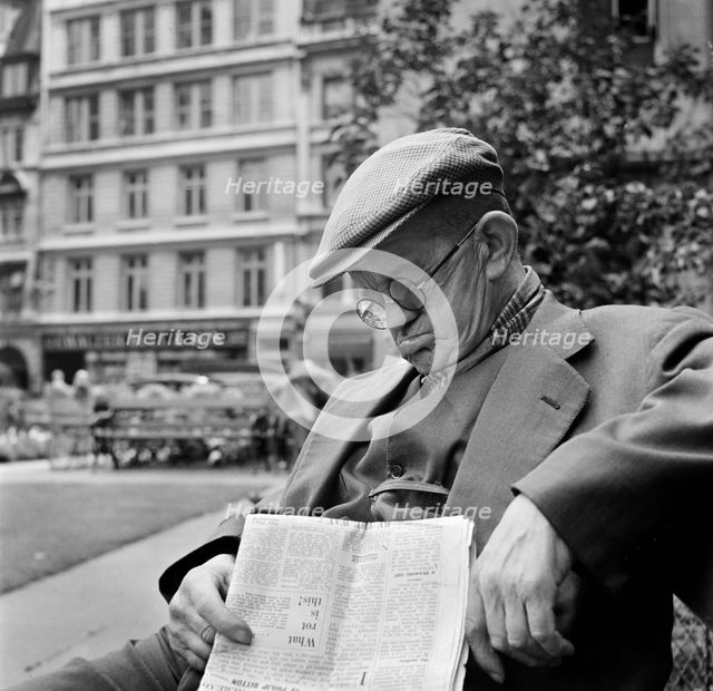 An elderly man asleep with his newspaper, City of London, c1946-c1959. Artist: John Gay