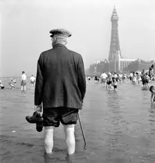 An elderly man paddling in the sea, Blackpool, c1946-c1955. Artist: John Gay