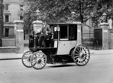 An electric motor cab and driver, London, c1897-c1900. Artist: York & Son