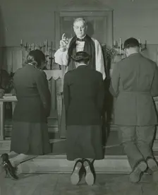 An Episcopal Bishop confirming African American Lieutenants Rosemary Vincent..., 1939 - 1945. Creator: United States Army