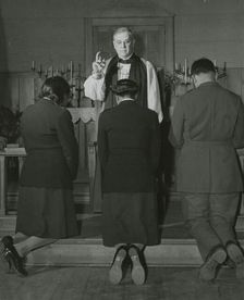 An Episcopal Bishop confirming African American Lieutenants Rosemary Vincent..., 1939 - 1945. Creator: United States Army