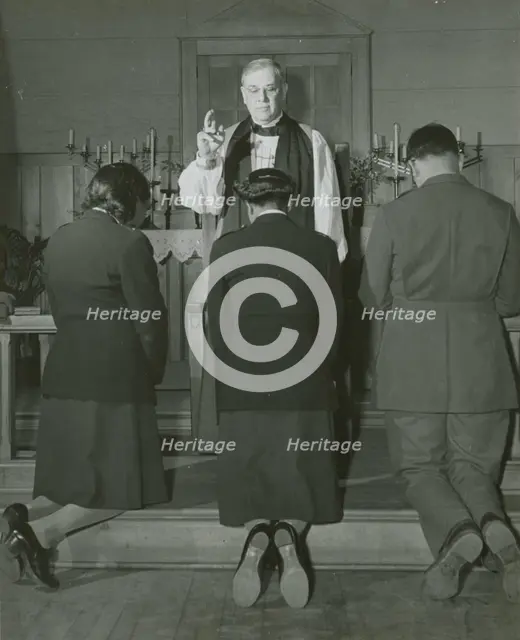 An Episcopal Bishop confirming African American Lieutenants Rosemary Vincent..., 1939 - 1945. Creator: United States Army.