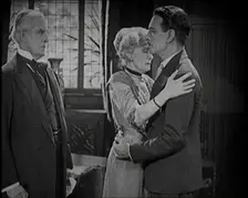 An Extract from a Silent Film. A Female Actor and a Male Actor Embrace. Another Male Actor..., 1920s Creator: British Pathe Ltd