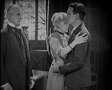 An Extract from a Silent Film. A Female Actor and a Male Actor Embrace. Another Male Actor..., 1920s Creator: British Pathe Ltd