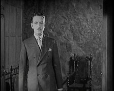 An Extract from a Silent Film. A Male Actor Enters Through a Door, 1920s. Creator: British Pathe Ltd
