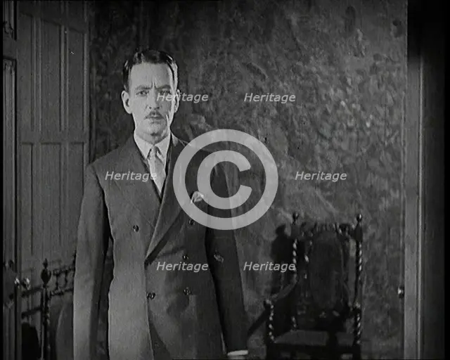 An Extract from a Silent Film. A Male Actor Enters Through a Door, 1920s. Creator: British Pathe Ltd.
