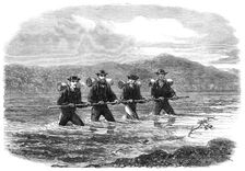 An Exploring Party on the West Coast of New Zealand: crossing the River Teramakau, 1865. Creator: Unknown