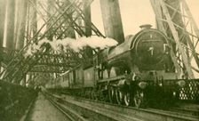 An Express Train Crossing the Forth Bridge c1930. Creator: Leslie J. Thompson