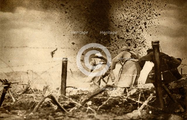 'An H.E. shell exploding', First World War, 1914-1918, (1933).  Creator: Unknown.