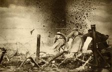 An H.E. shell exploding First World War, 1914-1918, (1933). Creator: Unknown