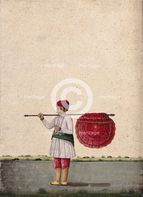 An Indian bearer holding a large, richly decorated fan or banner..., (between 1800 and 1899?). Creator: Unknown.