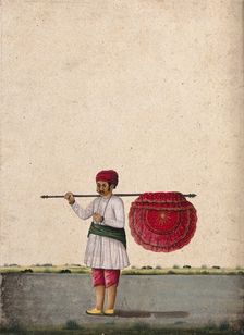 An Indian bearer holding a large, richly decorated fan or banner..., (between 1800 and 1899?). Creator: Unknown