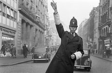 An informal portrait of a traffic policeman standing in the road, City of London, c1946-c1959. Artist: John Gay