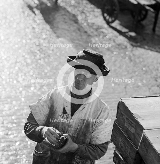 An informal portrait of a porter at Billingsgate Fish Market, City of London, c1946-c1959 Artist: John Gay