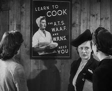 An Information Film Showing Women Looking at a Recruitment Poster for Female Army Cooks, 1942. Creator: British Pathe Ltd