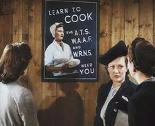 An Information Film Showing Women Looking at a Recruitment Poster for Female Army Cooks, 1942. Creator: British Pathe Ltd