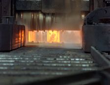 An ingot in a bloom mill, Park Gate Iron and Steel Company, Rotherham, South Yorkshire, 1966. Creator: Michael Walters