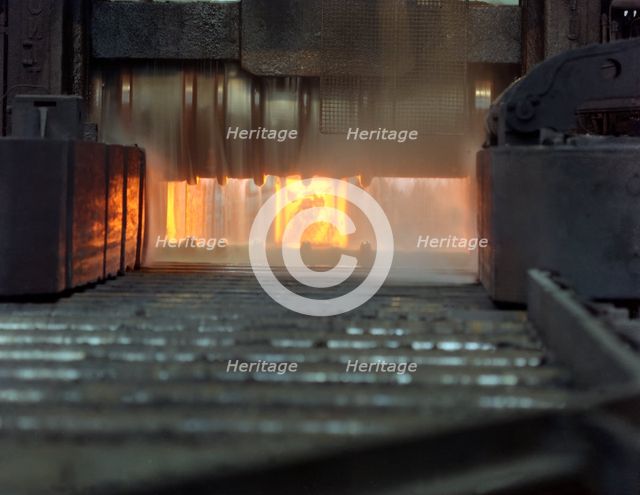 An ingot in a bloom mill, Park Gate Iron and Steel Company, Rotherham, South Yorkshire, 1966. Creator: Michael Walters.