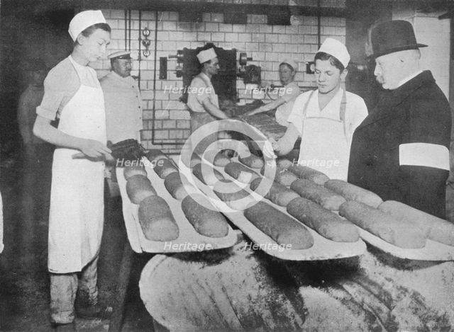 'An inspector visiting a Berlin bakery', 1915.  Artist: Unknown.