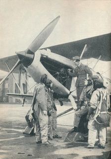 An instructor explaining engine details to a pupils at Sealand Aerodrome, Flintshire, c1936 (c1937)