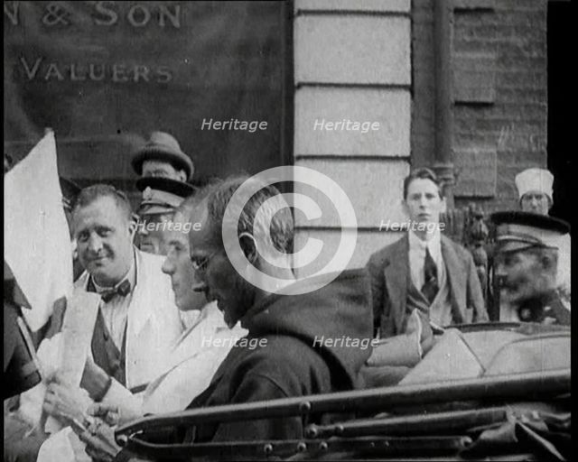 An Irish Priest Talking to a Soldier in a Car, Trying to Bring Peace, 1922. Creator: British Pathe Ltd.