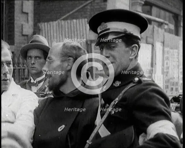 An Irish Priest Talking to a Soldier in a Car, Trying to Bring Peace, 1922. Creator: British Pathe Ltd.