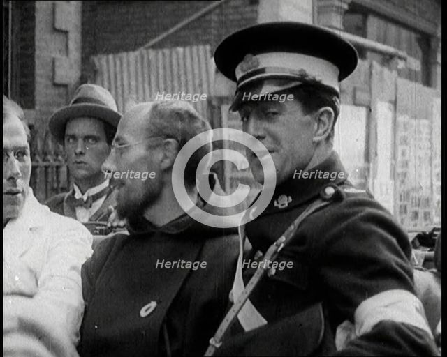 An Irish Priest Talking to a Soldier in a Car, Trying to Bring Peace, 1922. Creator: British Pathe Ltd.