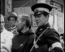 An Irish Priest Talking to a Soldier in a Car, Trying to Bring Peace, 1922. Creator: British Pathe Ltd