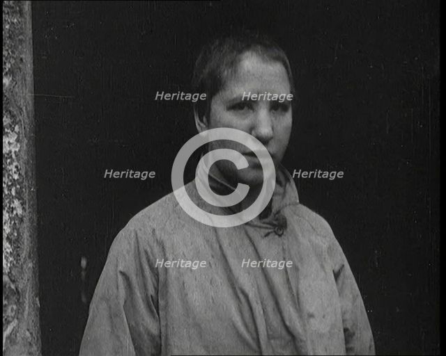 An Irish Woman Sporting a Shaved Head as Punishment for Consorting With British Soldiers, 1920. Creator: British Pathe Ltd.