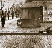 An onlooker observes a dead man left in the streets, Russia, early 20th century